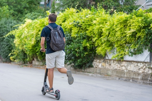 Eco-friendly mode of transport electric scooter thinking about the future and the planet - Stock Photo - Images