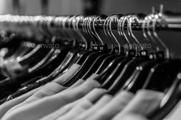 Row of cloth-racks. Many racks of clothes