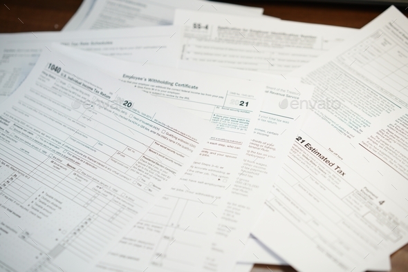 Filling up U.S. Individual Income tax return, 1040 form , withholding certificate  - Stock Photo - Images