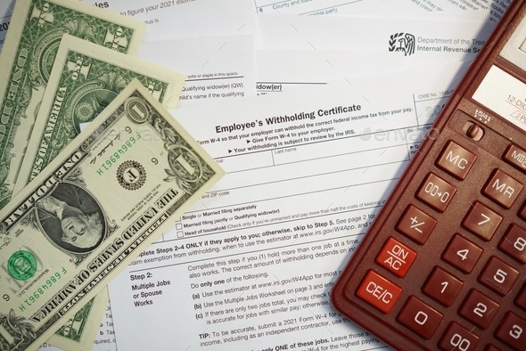 U.S. Individual Income tax return, 1040 , withholding certificate ,w-4 form - Stock Photo - Images