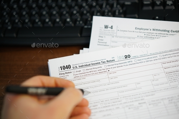 Filling income tax return - Stock Photo - Images