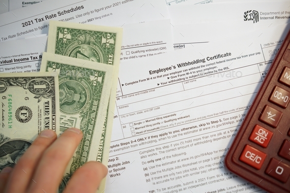 U.S. Individual Income tax return, 1040 , withholding certificate ,w-4 form - Stock Photo - Images