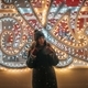 Girl standing in front of street Christmas illumination  - PhotoDune Item for Sale