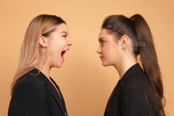 Boss screaming at frustrated employee, bullying and emotional abuse at work
