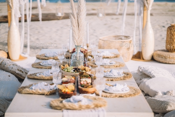 Bohemian style beach themed picnic wedding event - Stock Photo - Images