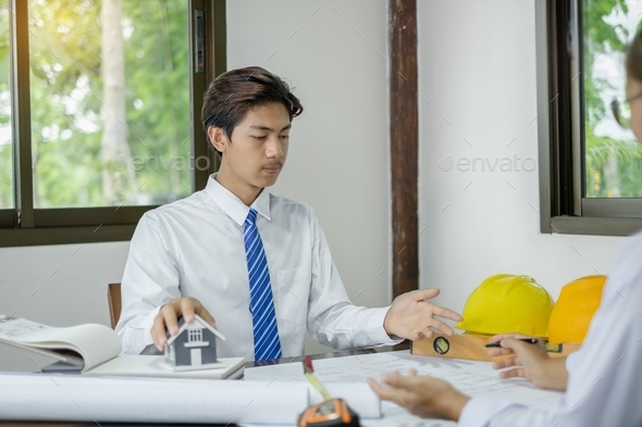 Team of male and female engineers and architects, working meeting, discussing construction, and home - Stock Photo - Images