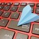 Paper plane origami on keyboard - PhotoDune Item for Sale