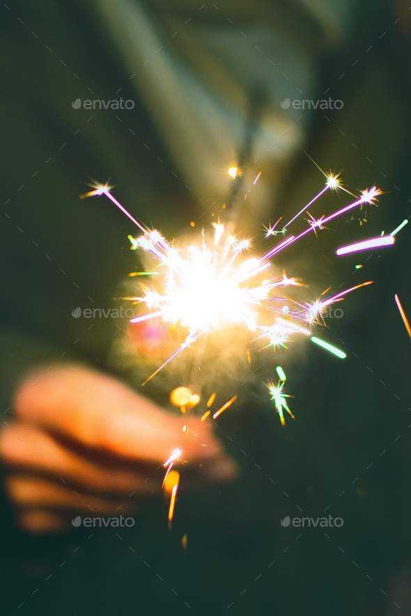 Celebrating the end of 2020 and the start of 2021 with a new year sparklers fireworks