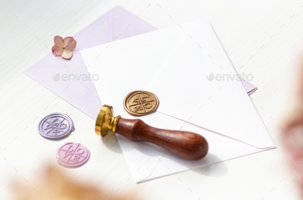Envelope and wax seal in different colors with the inscription - love
