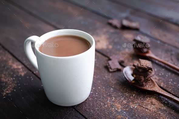 Chocolate milk in white cup with bar chocolate