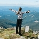 Freedom concept: girl standing on top of a mountain - PhotoDune Item for Sale