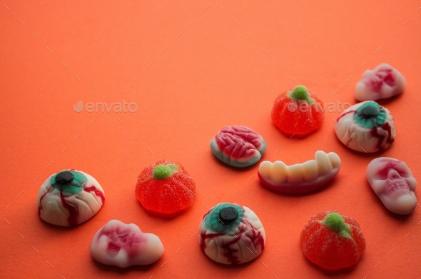 Halloween! Jelly candies in the form of eyes, brains, skulls, teeth with fangs, pumpkins. Copy space
