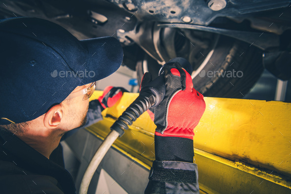 Mechanic Performing Scheduled Vehicle Inspection