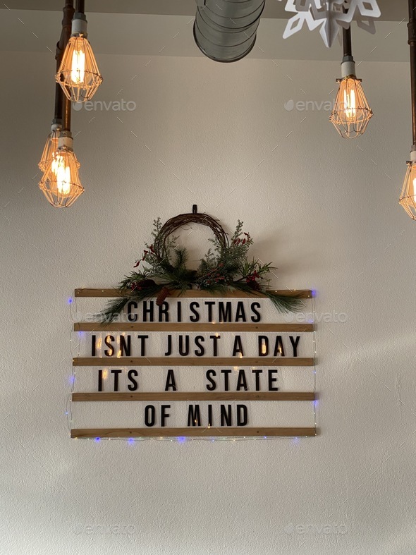 A sign says Christmas is a state of mind and attitude .
