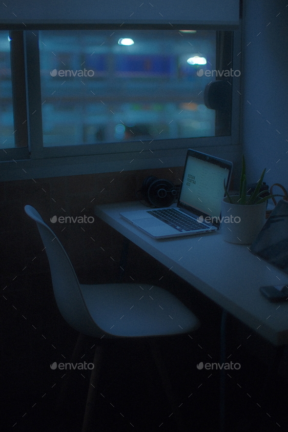 Home office with laptop at a beautiful night - Stock Photo - Images