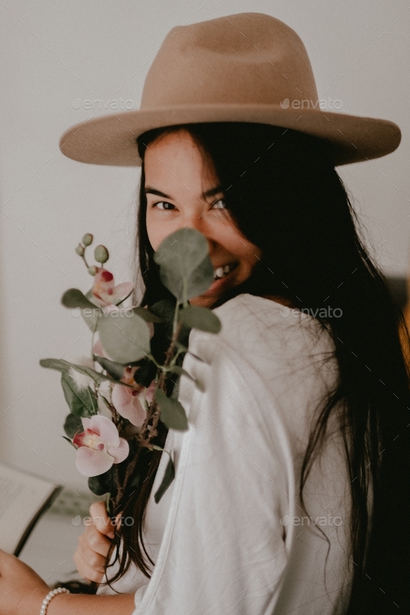 Happy Asian Girl with Hat and a Bunch of Flowers - Stock Photo - Images