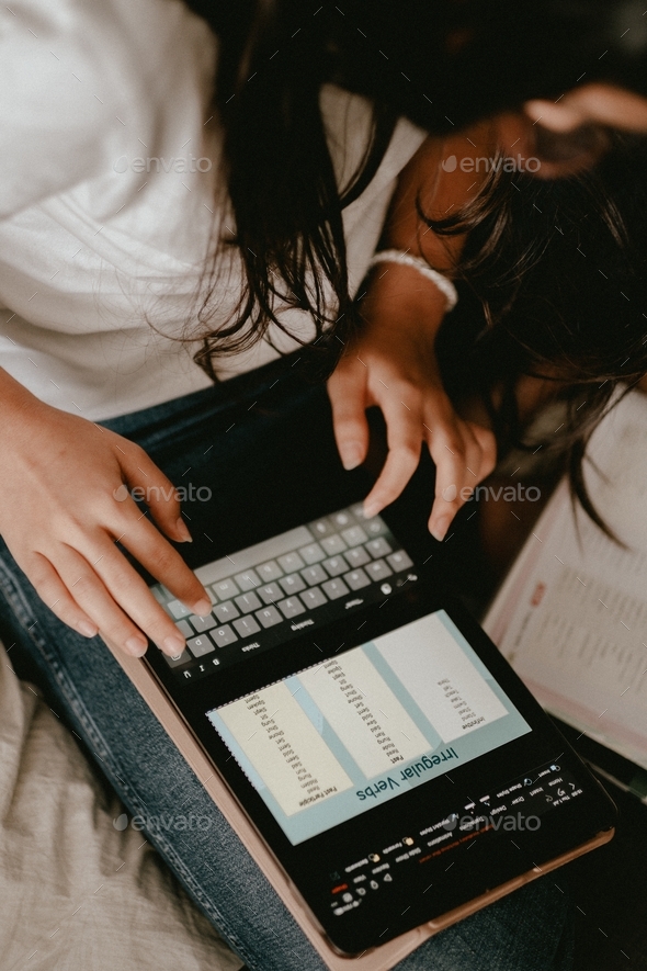 Student Typing on a Tablet - Stock Photo - Images