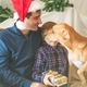 Dad and son in santa caps and dog on christmas - PhotoDune Item for Sale