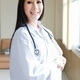 portrait of smart female doctor with a Stethoscope standing at reception of the hospital.
 - PhotoDune Item for Sale