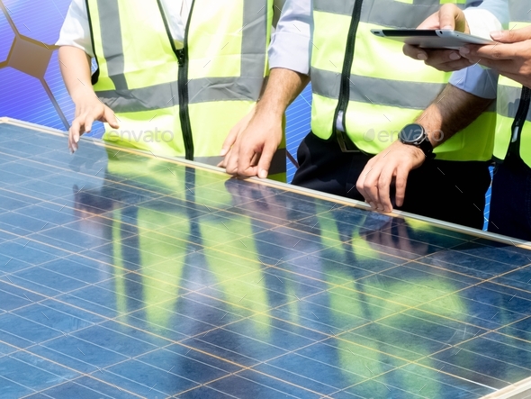 Foreman engineering male and female hardhat work job meeting electrician solar power renewable energ