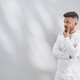 Surprised young male businessman on a white background and in white clothes - PhotoDune Item for Sale
