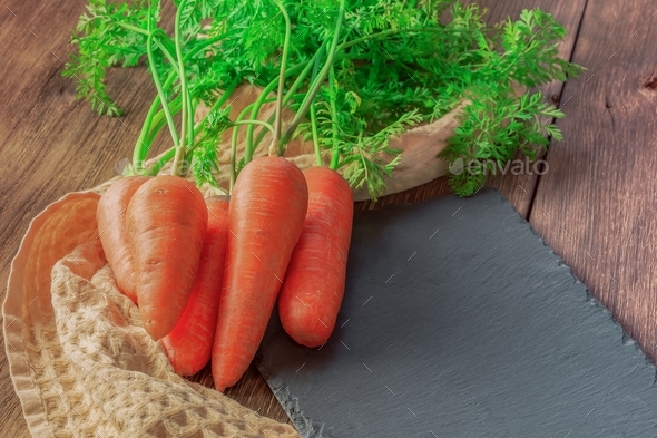 Fresh root vegetable, vegetarian food source of vitamins and keratin harvest orange carrots clean wa