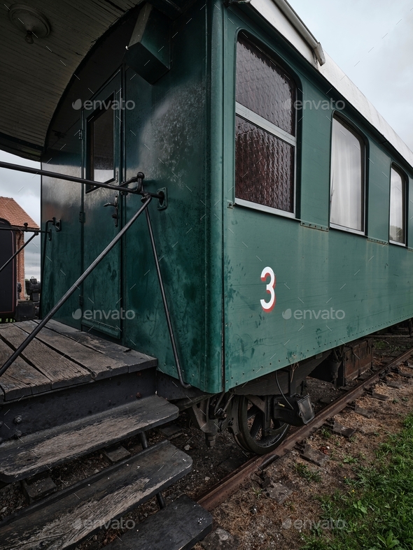 Old historic train green wagon number 3 in train depot
