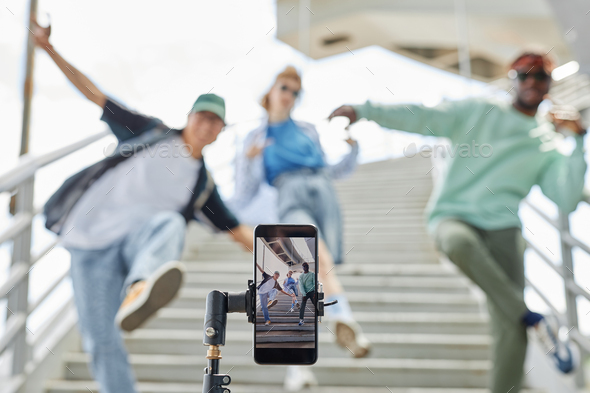 Close up of hip hop dance crew filming video for social media
