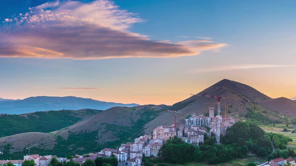 PAN: sunset over medieval village perched on hill top, Santo Stefano di Sessanio, Abruzzo, Italy. Ro alt