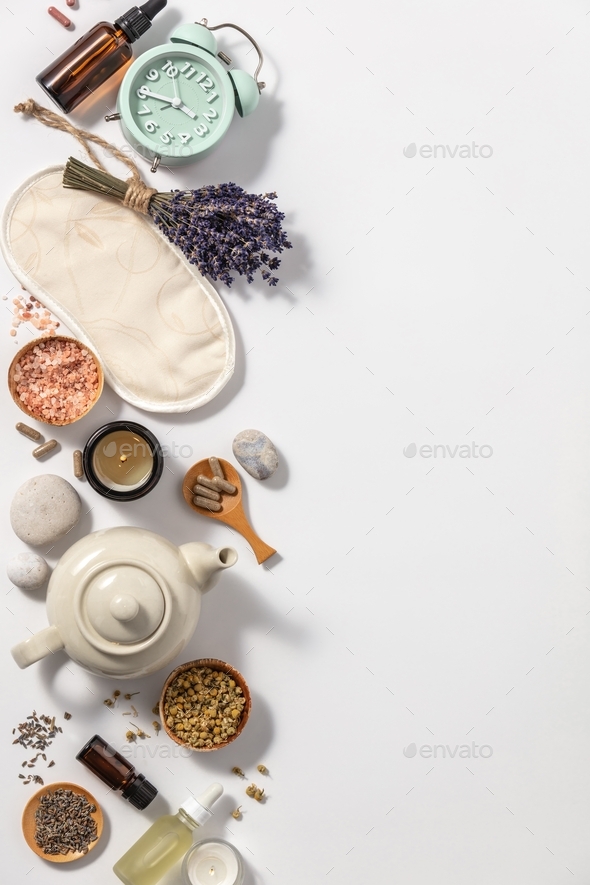 Herbal medicine for treat depression and insomnia concept. Alarm clock, medicine herbs, capsules, ca