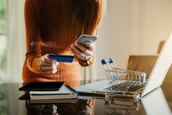 women shopping online is a form of electronic commerce from a seller over internet.