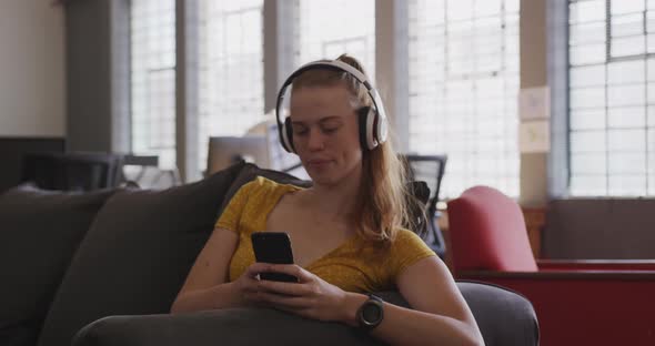 Young creative professional working in a modern office alt