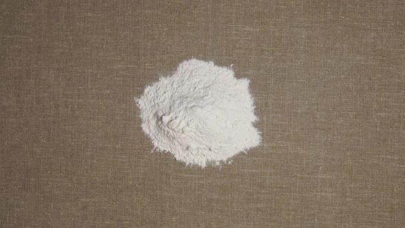 Flour On A Background Of Linen Fabric