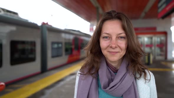 Lonely Abandoned Woman Is Standing on Platform and Looking on Leaving Train, Crying and Suffering alt