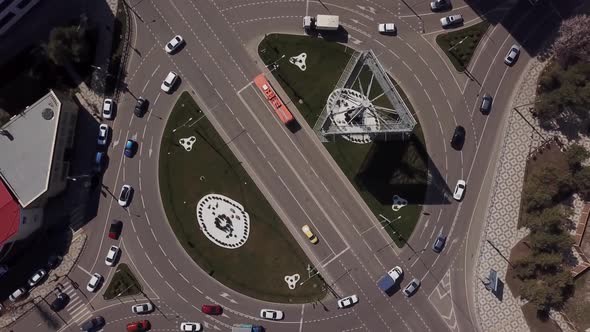 Top View Zoom Out Urban Road with Traffic Cars, Top Down View of Roundabout alt