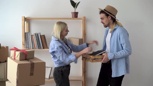 Happy Couple Moved to New House Young Family Celebrates Moving Together Smiling Man and Woman Have alt
