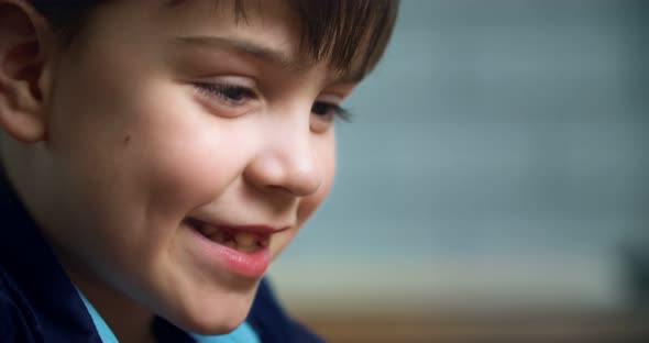 The boy is carefully considering something. The boy's head is with fair skin. sympathetic guy