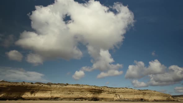 Time lapse of clouds in blue sky over Valdes Peninsula, Argentina alt