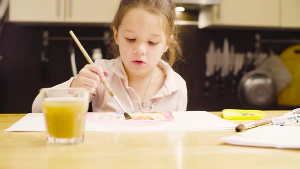 Young Artist Painting on Paper