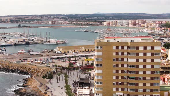 Vibrant city of Torrevieja in Spain, aerial drone orbit view alt