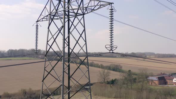 High Voltage Electrical Transmission Pylon Close Up Aerial View alt