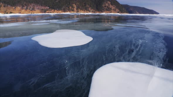 Bubbles Inside Thick Clear Transparent Ice on Frozen Baikal Lake