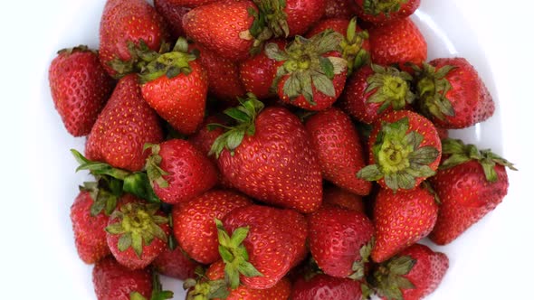 Strawberries rotating on a white background. Strawberry ripe season alt