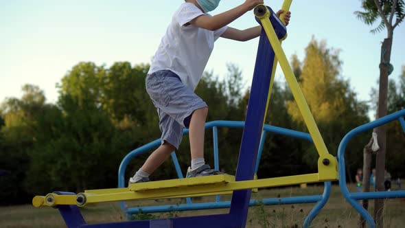 A Teenage Boy in a Medical Mask Is Engaged in Sports alt