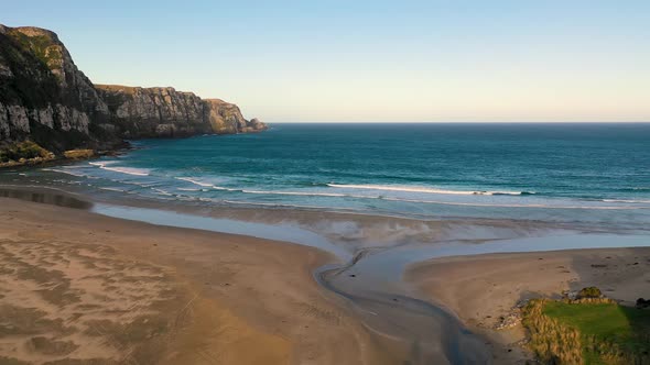 Aerial view of scenic sunset over Purakaunui Bay, New Zealand. alt