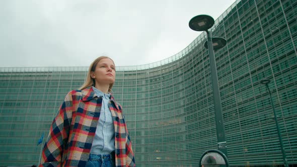 Woman Walks Along European Flags Near EU Commission Office in Brussels Belgium