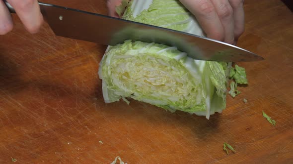 Closeup of Slicing Chinese Cabbage Slow Mo