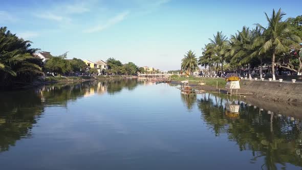 Motion Over River with Gold Turtle Statue and Fishing Boat alt