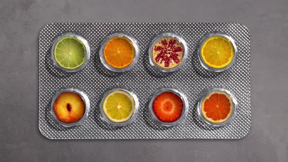 Blister Of Medicines Filling With Fresh Sliced Ripe Fruit. Vitamins And Healthcare. Flat Lay.