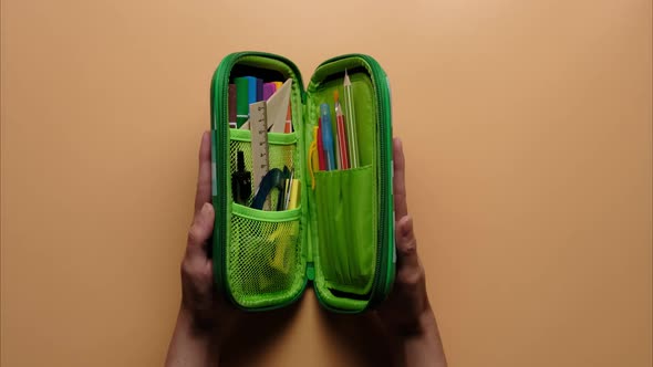 Stop Motion of Colored School Pencil Case with School Supplies